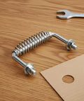BBQ Grill Handle Replacement Screw On Stainless Steel 5 3 Eighth Inch Spiral Spring Handle Upgrade With One Half Inch Rod For Outdoor Smokers And Stoves Durable Secure Mount, shown with bolts