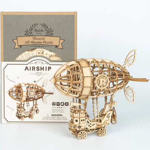 3D Wooden Airship Puzzle Kit For Kids And Adults Build Your Own Model Ship In 1 To 2 Hours 176 Laser Cut Pieces With Easy Instructions And Sandpaper showing completed model and packaging.