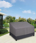Heavy Duty 2 Seater Outdoor Loveseat Cover Waterproof Windproof With Air Vent 58 Inch Wide 32.5 Inch Deep 31 Inch High Gray Dark Gray Patio Furniture Sofa Cover Built Tough covering a patio sofa on a sunny day.