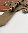 Workhorse Sliding Bolt Door Latch Secure Slide Lock For Garden Barn Fence Shed And Patio Gate Bronze close-up view on wooden surface