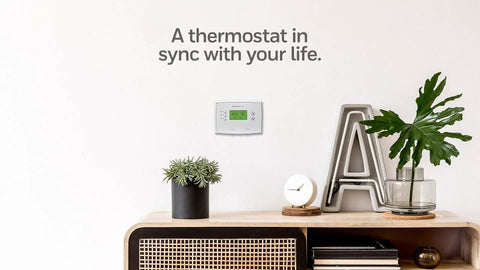 5 2 Day Programmable Thermostat With Easy Weekday Weekend Scheduling Precise Temperature Control To Within 1 Degree on a white wall