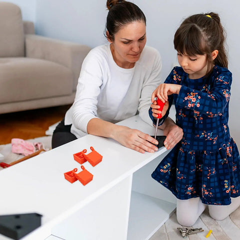 Child and adult assembling furniture with 4 Piece Woodworking Ratchet Band Clamp Blocks Set For Secure Frame And Corner Assembly.