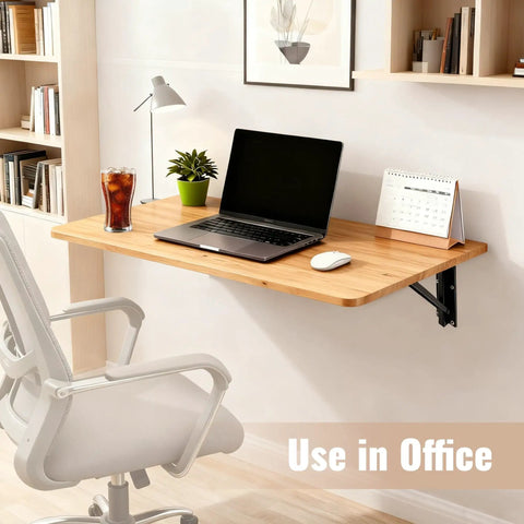 Wall Mounted Folding Table For Garage And Laundry Room Use, Handy Home Wall Desk And Folding Workbench, Space Saver That Handles Up To 100 Lbs, Solid Wall Mount Only, 15.7 By 31.5 Inches, Easy Fold Down Surface with laptop and chair in office setting.
