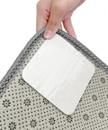 Image of hand applying 8 Pack Non Slip Rug Grippers For Hardwood Floors Washable And Reusable Carpet Tape That Keeps Rugs Flat And Safe For Kids And Pets In Busy Homes 3.9 X 3.9 Inches to rug corner.