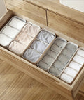 Stackable Plastic Underwear Storage Containers With Divided Compartments To Straighten Up Your Wardrobe Kick Clutter To The Curb Keeping Socks Bras Neck Ties Squeaky Fresh organized in wooden drawer.