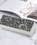 Industrial Metal Gear Textured Leather Eyeglass Case With Heavy Duty Magnetic Closure and Ultra Soft Velvet Lining on desk.