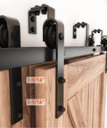 Close-up of Six Foot Double Track Bypass Sliding Barn Door Hardware Kit For Two Doors Low Ceiling Friendly Easy Install J Shape Hanger Fits 36 Inch Wide Door Panel installed on a wooden door.