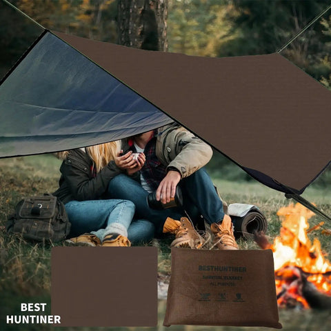 Campers using Beefy Heavy Duty Survival Blanket With Reflective Tarp For Camping And Outdoors Waterproof Sandproof Thermal Emergency Blanket Ultra Portable Foldable In Compact Carry Bag For Easy Stowaway 60x83 Inches by a campfire.