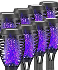 Solar Tiki Torch Lights Eight Piece Purple Outdoor Garden Decor With Realistic Flickering Flame For Halloween Parties