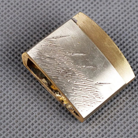 Solid Brass Habaki Collar Clip For Katana Blade Keeps Tsuba Locked In Place And Secure Inside Saya close-up on textured surface