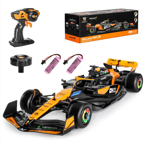 McLaren F1 Officially Licensed One Fourteenth Scale Remote Control Car With Two Rechargeable Batteries And Two Point Four GHz Radio Control For High Speed Hobby Racing A Rad Collectible Gift For Adults And Kids, shown with controller and battery pack.