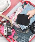 Heavy Duty Hard Shell Tech Carry Pouch For Chargers Power Banks Cables And Earbuds With Water Resistant Cover in a suitcase.