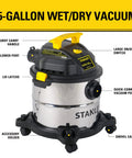 Beast Of A 5 Gallon Wet Dry Shop Vacuum With 4 Peak HP Motor Stainless Steel Tank Portable Vac For Home Garage And Jobsite Dust Cleanup Includes Attachments Silver And Yellow with sturdy carry handle and quick-connect vacuum port.