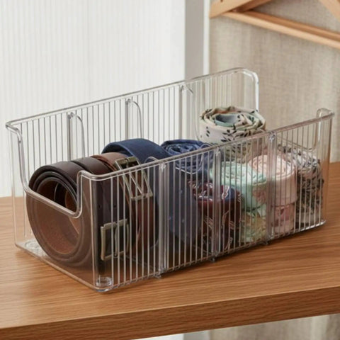 Top Shelf Crystal Clear Acrylic Belt Organizer With Removable Dividers Stackable Storage Bin for ties and watches on wooden surface.