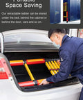 Person storing Grab This Bad Boy Compact Fiberglass Telescoping Ladder For Electrical Work That Is Super Sturdy Non Conductive With Wide Anti Slip Treads And Secure Locks Handling Three Hundred Thirty Pounds Like A Champ In Two To Six Meter Sizes in a car trunk.