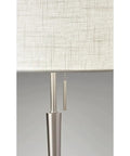 Close-up of Hayworth Table Lamp With White Linen Drum Shade And Brushed Steel Finish 22 Inch Tall Pull Chain 150 Watt