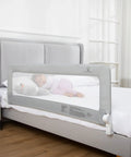 Keep Lil Ones Snuggled With This Smooth Swing Down Toddler Bed Rail on a twin mattress with a sleeping child.