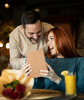 Couple enjoying Brown Kraft Gift Bags With Handles 5.25 By 3.75 By 8 Inch Heavy Duty 100G Bulk Pack for gifting.