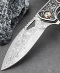 Dope Damascus Steel Folding Pocket Knife With 3.46 Inch Drop Point Blade ornate handle design by stone