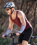 Man cycling wearing Set Of Three Cut Resistant Arm Sleeves Lightweight Thumb Hole Guards For Yard Work Kitchen Chores Secure Grip Protection Soft Comfort Fit Quick Flip Design No Sweat Daily Carry.
