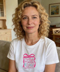 Woman wearing white T-shirt with floral bow and text design, Mama Iron On Transfers For Christian Moms Floral Bow Pack, at home