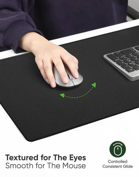 Large Gaming Mouse Pad With Non Slip Rubber Base And Edge Stitching For Desk Laptop PC Wrist Rest For Gamer Office And Home Classic Black XL 11.81 x 31.50 x 0.12 Inches featuring a smooth surface and keyboard next to it.