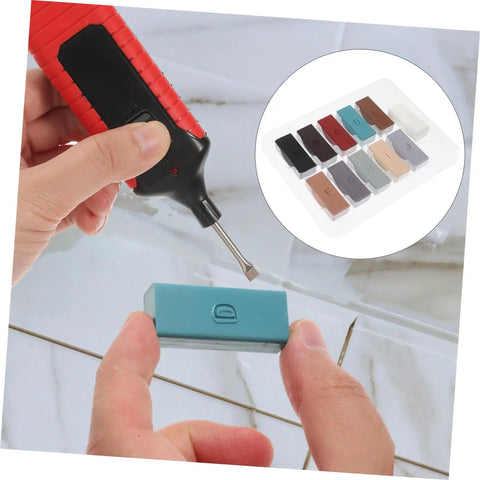 Close-up of Wood Floor And Furniture Repair Kit With Durable Wax Blocks For Quick Scratch Fixes on porcelain tiles using tool