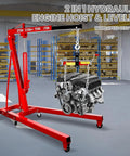 Heavy Duty Two Ton Folding Engine Hoist With Six Swivel Caster Wheels And Precision Leveler lifting an engine in a workshop.