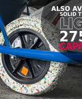 Close-up of a Beefy 14 Inch Wheelbarrow Tire With Flat Free Design Made From Recycled Rubber Delivers 440 Pounds Capacity And Universal Axle Fit For Common Hub Sizes Includes 2 Spacers For Garden Wagons And Utility Carts on blue wheelbarrow.