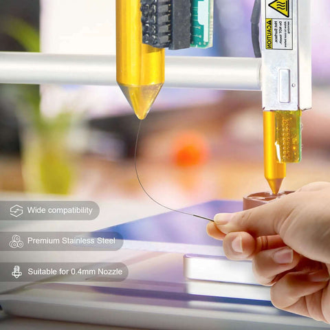Person using Nozzle Cleaning Kit For 3D Printers With Brush And Pro Tools, operating on a 3D printer nozzle with a cleaning needle.