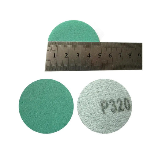 Premium 50mm Sanding Discs Hook Loop With Eight Holes For Fast Dust Removal, showing two 50mm zirconia discs and a ruler.