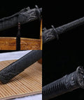 Close-up of Beefy Damascus Tang Dao Sword With Black Gold Finish, detailed handle and scabbard design, handcrafted for display.