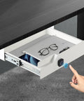 Sleek Under Desk Drawer With Biometric Fingerprint Lock Smooth Metal Slide Tray No Key Hassle Secret Stash For Laptops Paper Everyday Carry In Crisp White with open drawer displaying tablet and glasses.