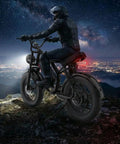 Rider on 1500W Peak Electric Fat Tire Mountain Bike For Adults With 32 MPH Top Speed, 20 Inch Fat Tires, nighttime view