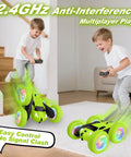Kids playing with Rad Stunt RC Car With Two Point Four GHz Remote 360 Degree Flips Double Sided Crawler in bright green