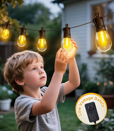 Outdoor String Lights 50 Ft Waterproof Patio Led With 15 S14 Edison Bulbs Remote Dimmable hanging in backyard with child observing