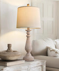 Mid Century 24.5 Inch Table Lamp Set of 2 for Living Room and Bedroom Rustic Beige Resin Bases With Linen Shade End Table Nightstand Lamps for Dorm Office Cozy Vibe Soft Light shown on a decorative table next to a cozy sofa.