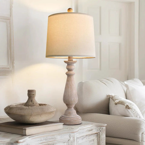 Mid Century 24.5 Inch Table Lamp Set of 2 for Living Room and Bedroom Rustic Beige Resin Bases With Linen Shade End Table Nightstand Lamps for Dorm Office Cozy Vibe Soft Light shown on a decorative table next to a cozy sofa.