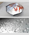 Rock Solid Self Adhesive Waterproof Membrane Roll used in a makeshift pond with goldfish and droplets on foil surface.