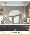 Gold Glass Pendant Light Set Of 3 With Crackle Glass Shades hanging in modern bathroom over double sink vanity