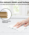 Close-up of a hand wiping a water-proof surface made of Medium Density Fiberboard, showcasing easy-clean feature.