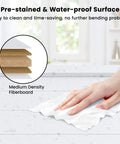 Close-up of hand cleaning a pre-stained waterproof surface with Medium Density Fiberboard illustration in background