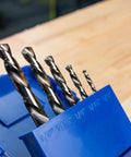 5-piece set of Left Hand Drill Bit For Metal Working With Cobalt M35 Steel Split Point Tips Self Centering Built To Cut Through Hardened Metals Bolts And Studs With Precision Durable Wear Resistant Drill Bit For Tough Jobs in blue holder