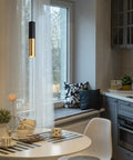 Get These Cool Black And Gold Modern Pendant Lights With Adjustable Cords Cylinder Design Perfect For Kitchen Island Dining Bedroom Living Room Vibes, lighting a cozy kitchen corner with a window.