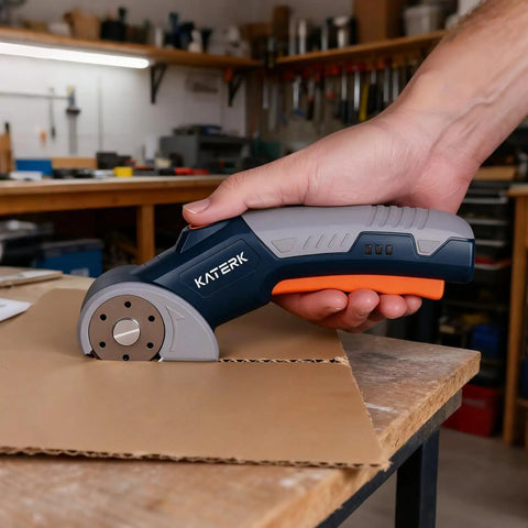 Katerk Cordless Electric Box Cutter With Safety Lock And Led Light cutting cardboard on a workbench with precision.