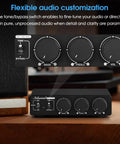 Control panel of Beast 300W Per Channel Class D Stereo Amplifier for home theater with bass, treble, and volume knobs