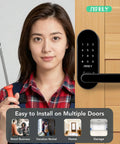 Woman holding screwdriver next to keyless entry keypad smart door lock with handle installed on wooden door for app control access.