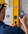 Kickass Precision Laser Measuring Tool Providing 165 Foot Range Dual Bubble Levels and Fast Unit Swapping used for measuring alongside a level.