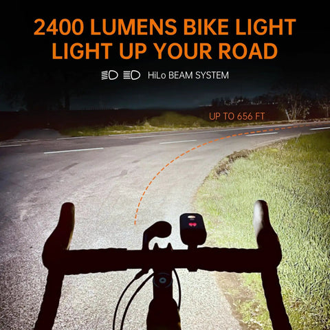 PR2400 2400 Lumen Mountain Bike Light with OLED Runtime Display illuminating a road with high beam and anti glare low beam