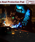 2 Pack 11x14 Inch Welding Blanket, 5mm Thick Fireproof Carbon Felt Heat Shield For Soldering, Fire Pit, Grill And Welding Supplies, Heavy Duty Pro Grade, Grill Ready, Ultra Heat Resistant To 3000 Degrees Fahrenheit, Flame Retardant UL94-V0 ASTM D6413 shown in use protecting surface from welding sparks